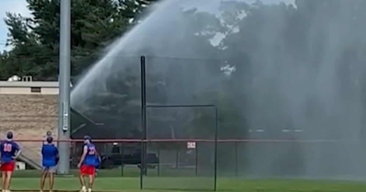 firefighter-baseball-field-flood